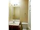 Cozy half bathroom featuring white fixtures and a vanity with storage at 6398 Shadow Sq, Lithonia, GA 30058