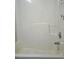 Clean white bathtub with built-in seat in an alcove setting at 6398 Shadow Sq, Lithonia, GA 30058
