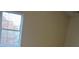 Bedroom featuring a window offering natural light and pleasant outdoor views at 6398 Shadow Sq, Lithonia, GA 30058