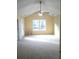 Spacious bedroom with a large window, ceiling fan, and neutral carpet at 6398 Shadow Sq, Lithonia, GA 30058
