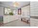 Elegant bathroom with double vanity, subway tile, and a patterned floor at 1384 Jefferson Ave, East Point, GA 30344