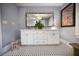 Clean bathroom, double vanity, and black and white checkered floor at 1384 Jefferson Ave, East Point, GA 30344