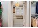 Laundry room with window, wood bench, and black and white floor tile at 1384 Jefferson Ave, East Point, GA 30344