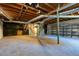 Unfinished basement offers ample storage space with shelving and workshop area at 2878 London Ne Ct, Marietta, GA 30062