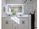 Elegant bathroom with double vanity and a frameless glass shower at 2878 London Ne Ct, Marietta, GA 30062