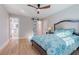 Spacious bedroom with light walls, hardwood floors, and barn door at 2878 London Ne Ct, Marietta, GA 30062