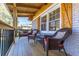 Inviting front porch with wicker chairs and wooden flooring at 2878 London Ne Ct, Marietta, GA 30062