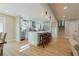 Open concept kitchen with island and hardwood floors, view into living room at 2878 London Ne Ct, Marietta, GA 30062