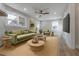 Cozy living room with green sofa and wood floors at 2878 London Ne Ct, Marietta, GA 30062