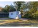 White metal storage shed in backyard provides additional storage at 2878 London Ne Ct, Marietta, GA 30062