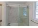 Bathroom with a shower/tub combo and marble-look tile at 3936 Devonshire Dr, Marietta, GA 30066