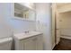 Clean bathroom with a white vanity, a toilet, and access to another room at 3936 Devonshire Dr, Marietta, GA 30066