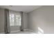 Simple bedroom with two windows and light gray walls at 3936 Devonshire Dr, Marietta, GA 30066