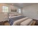 Bright bedroom with hardwood floors and a window at 3936 Devonshire Dr, Marietta, GA 30066