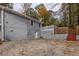 Gray house exterior with a basement access door at 3936 Devonshire Dr, Marietta, GA 30066