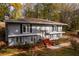 Two-story house with a brick facade and a red brick staircase at 3936 Devonshire Dr, Marietta, GA 30066