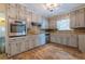 Kitchen with gray cabinets, granite countertops, and wood floors at 3936 Devonshire Dr, Marietta, GA 30066