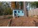 Cute playhouse in the backyard, near the wooden fence at 3936 Devonshire Dr, Marietta, GA 30066