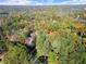 Wide shot of house and surrounding landscape at 2680 Spalding Dr, Sandy Springs, GA 30350