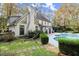 Landscaped backyard with hammock and pool view at 2680 Spalding Dr, Sandy Springs, GA 30350