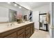 Bathroom with double sinks and a large mirror at 2680 Spalding Dr, Sandy Springs, GA 30350