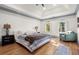 Main bedroom with hardwood floors and sitting area at 2680 Spalding Dr, Sandy Springs, GA 30350