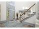 Bright and airy entryway with hardwood floors and staircase at 2680 Spalding Dr, Sandy Springs, GA 30350