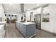 Modern kitchen with large island, stainless steel appliances, and white cabinets at 2680 Spalding Dr, Sandy Springs, GA 30350