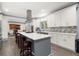 Modern kitchen with large island, stainless steel appliances, and white cabinets at 2680 Spalding Dr, Sandy Springs, GA 30350