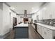 Modern kitchen with large island, stainless steel appliances, and white cabinets at 2680 Spalding Dr, Sandy Springs, GA 30350