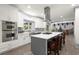 Modern kitchen with island, stainless steel appliances, and white cabinets at 2680 Spalding Dr, Sandy Springs, GA 30350