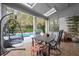 Relaxing pool patio with seating and a hanging chair at 2680 Spalding Dr, Sandy Springs, GA 30350