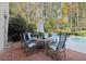 Brick patio with table and chairs near the pool at 2680 Spalding Dr, Sandy Springs, GA 30350