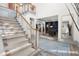 Elegant staircase with neutral carpeting and a light-colored railing at 2680 Spalding Dr, Sandy Springs, GA 30350