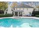 Relaxing pool area with a spa and surrounding patio at 2680 Spalding Dr, Sandy Springs, GA 30350