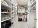 Large walk-in closet with ample shelving and hanging space at 2680 Spalding Dr, Sandy Springs, GA 30350