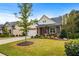 Brick and board and batten home with a two-car garage and landscaped front yard at 3760 Montebello Pkwy, Cumming, GA 30028