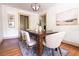 Dining room with wooden table and light-colored chairs at 2791 Pearl St, East Point, GA 30344