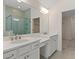 Bathroom boasts double vanity, large mirror, and a walk-in shower at 212 Harvest Trl, Hiram, GA 30141