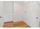 Bright laundry room with white cabinets and wire shelving at 212 Harvest Trl, Hiram, GA 30141