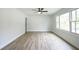 Bright living room with large windows and modern ceiling fan at 220 Hicks Se Dr, Marietta, GA 30060