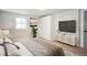 Serene main bedroom featuring a plush bed, modern decor, and a large window for natural light at 220 Hicks Se Dr, Marietta, GA 30060