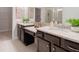 Elegant main bathroom with double vanity, granite countertops, and decorative mirrors at 1341 Cedarcrest Blvd, Acworth, GA 30101