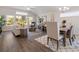 Inviting living and dining area featuring large windows and stylish decor, a perfect gathering space at 1341 Cedarcrest Blvd, Acworth, GA 30101