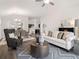 Spacious living room that opens to the kitchen and dining areas with modern finishes at 1341 Cedarcrest Blvd, Acworth, GA 30101