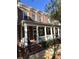 Townhouse exterior featuring a brick facade and porch at 617 Brennan Dr, Decatur, GA 30033