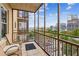 Screened balcony with city views and seating at 300 Peachtree Ne St # 6C, Atlanta, GA 30308