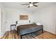 King bedroom with ceiling fan and hardwood floors at 300 Peachtree Ne St # 6C, Atlanta, GA 30308