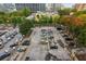 Aerial view of ample parking lot with numerous cars at 300 Peachtree Ne St # 6C, Atlanta, GA 30308