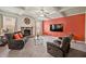 Cozy living room features a fireplace, coffered ceiling, and plush seating for relaxing evenings at 235 Silver Ridge Rd, Covington, GA 30016